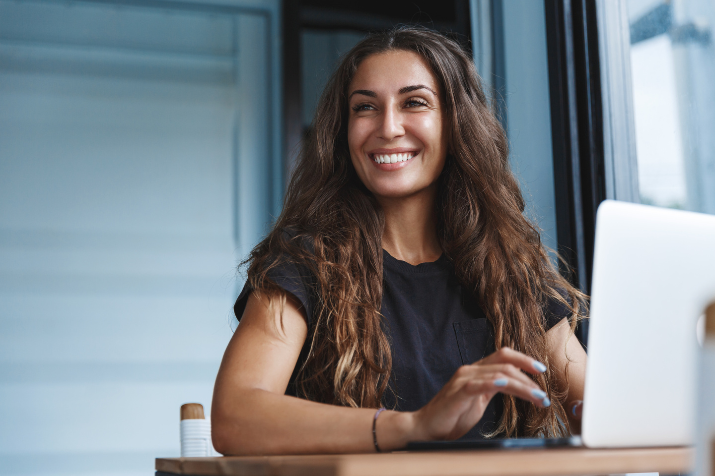 women smiling and typing